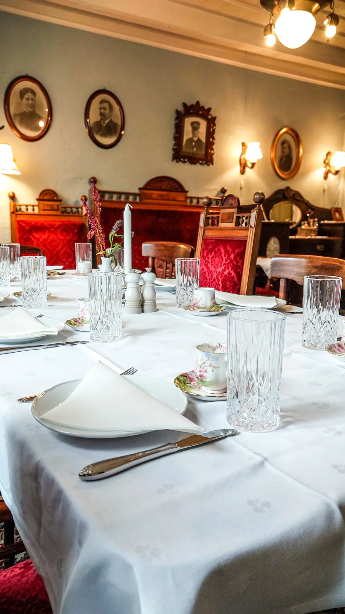 photo of a table prepared for dinner in the living room